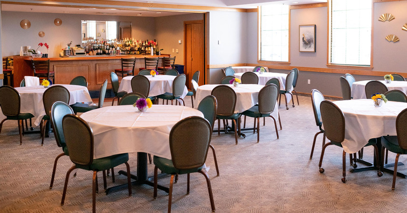 Tables for four ready for guests