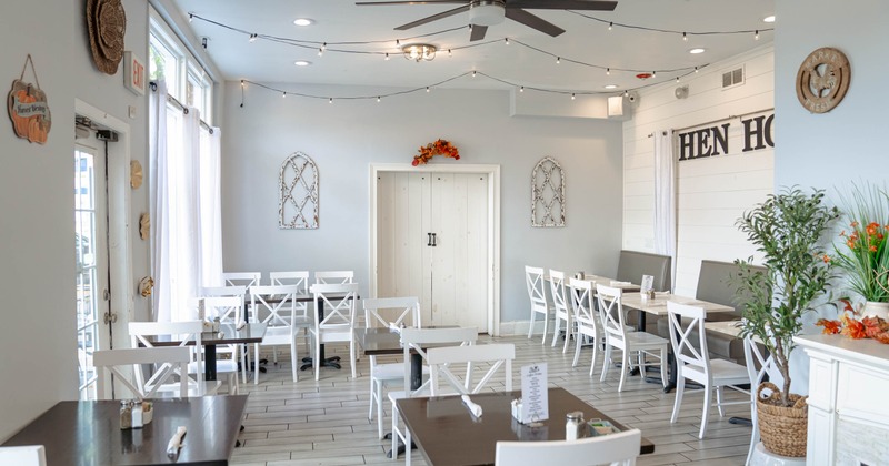 Interior, seating area with wooden tables and chairs