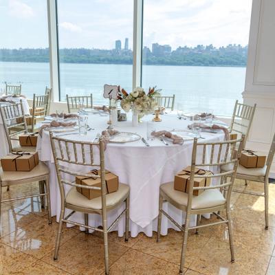Round dining table overlooking the waterfront.