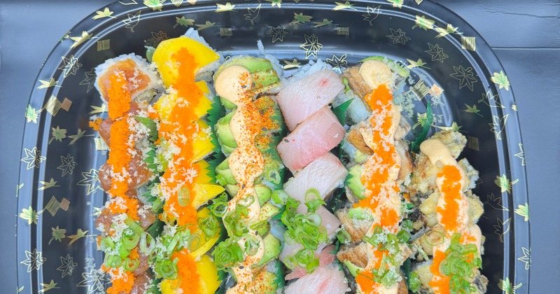 A tray with assorted sushi rolls