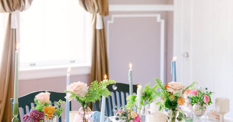 Fully set table, with candles and flowers