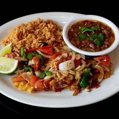 Grilled fish tipped with onion, jalapenos, and tomato, served with rice and drunken beans.