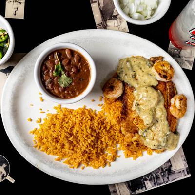Grilled tilapia and shrimp, with sauce, rice, and beans.