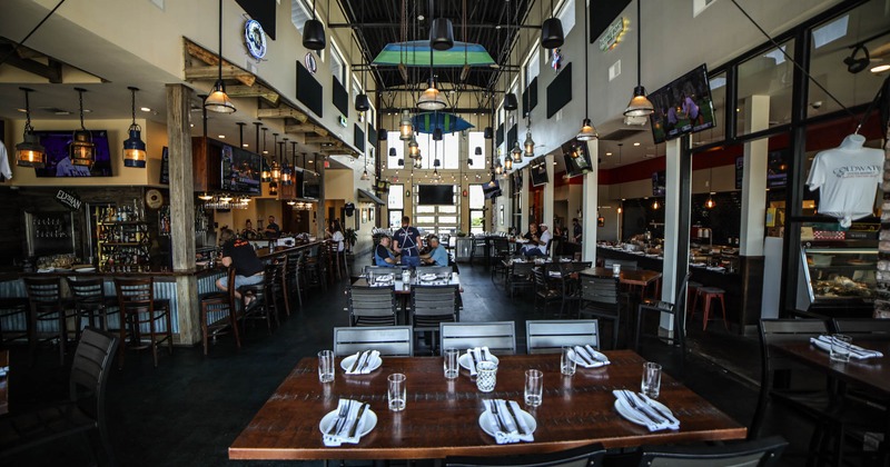 Dining room, bar on the left, counter and kitchen on the right