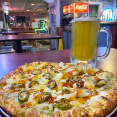 Served pizza with a glass of beer.