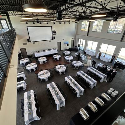 Banquet hall with tables set for an event.