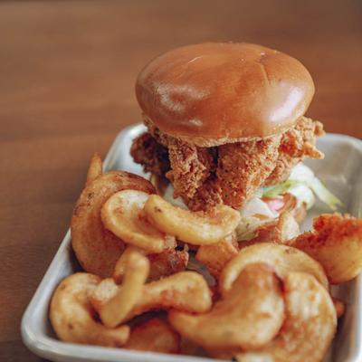 The clucking hen burger with fries.
