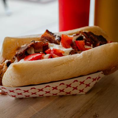 Daves' Black and Bleu sandwich with pulled chicken thighs, diced tomatoes and bacon.