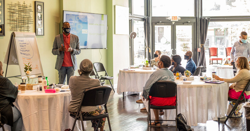 Interior, guests listening to a lecture