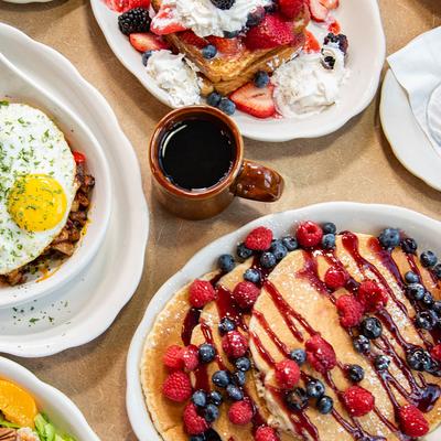 Overhead view of assorted dishes spread on a table.