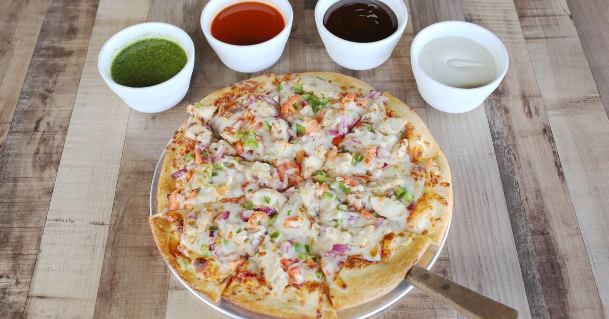 A served Create Your Own pizza