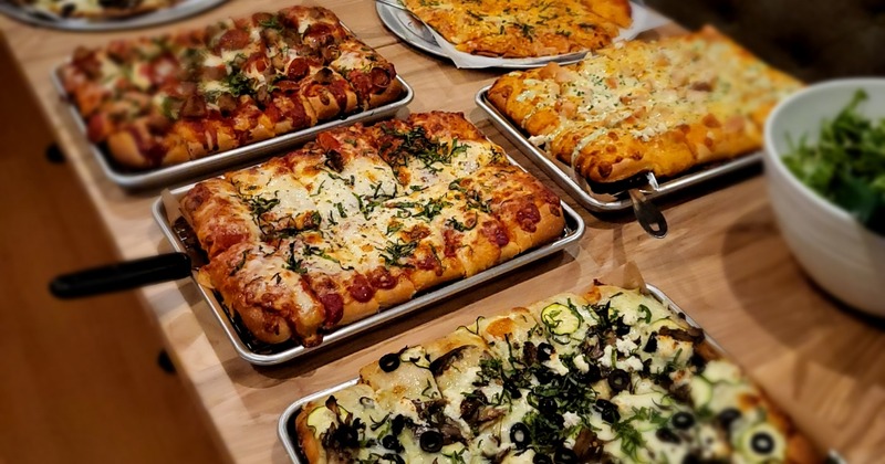 Assorted pizzas arranged on a table