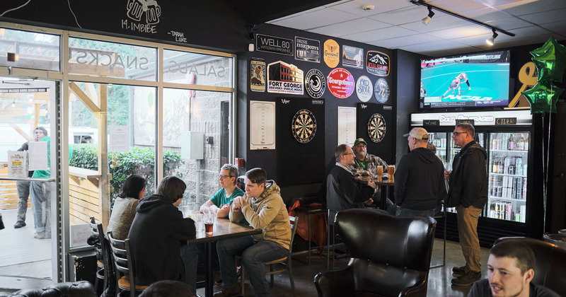 Interior, windows view, lots of guests, TV screen