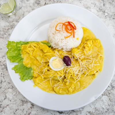 Peruvian chicken stew with rice and a hard-boiled egg.
