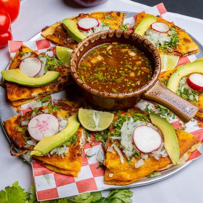 Birria tacos with dip.