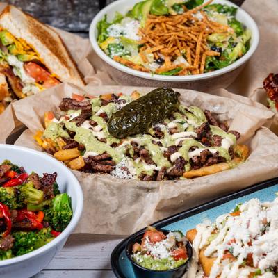 Table full of different dishes.