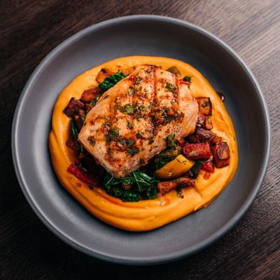 Grilled Salmon* (GF, VA) img Roasted Sweet Potatoes, Grilled Peppers, Kale, Carrot-Tahini Puree, Smoked Paprika Vinaigrette.