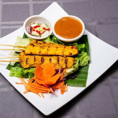 Papaya skewers with peanut sauce and cucumber salad.