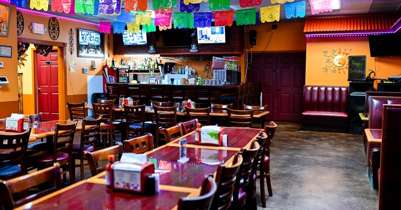 Interior, seating area with a bar in the back