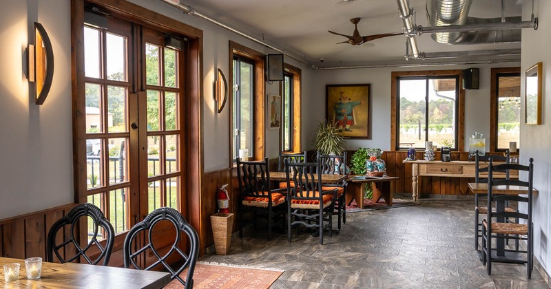 Interior, tables with chairs waiting for the guests