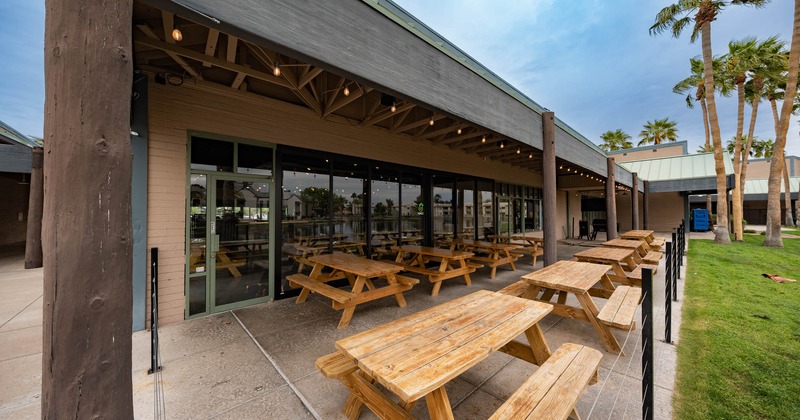 Exterior, long tables with benches, different angle