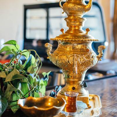 Teapot and a glass of tea.