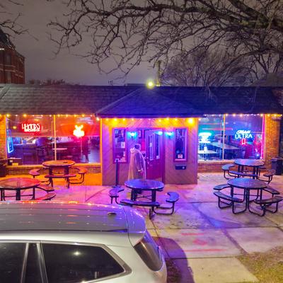 The patio outside and a parked car.