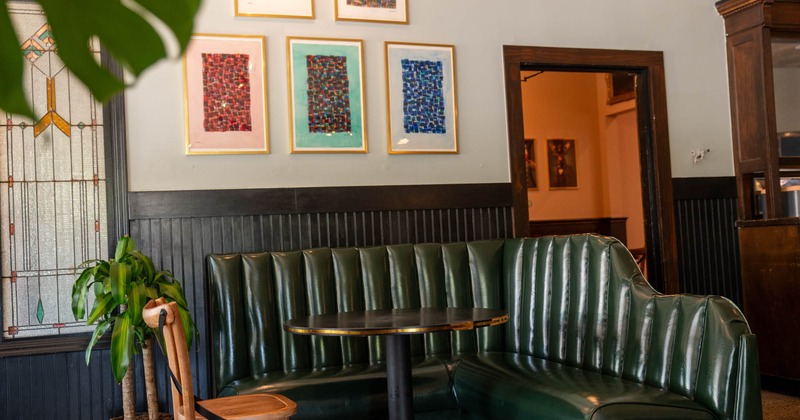 Upholstered booth with round table