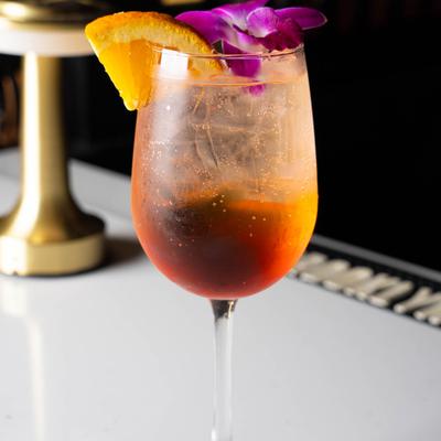 A served drink with a flower.