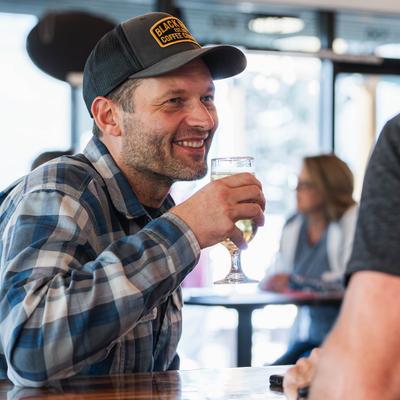 A person holding a drink.