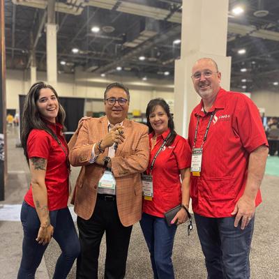 The owner with his family and Rafael Nodal.