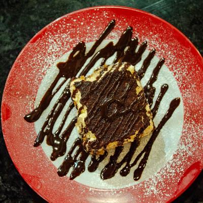 Tiramisu with chocolate drizzle.