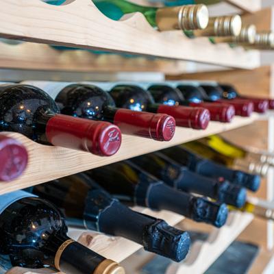 Vine shelf with bottles, closeup.