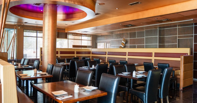 Interior, dining area, tables for two and four, banquette bench with tables and chairs