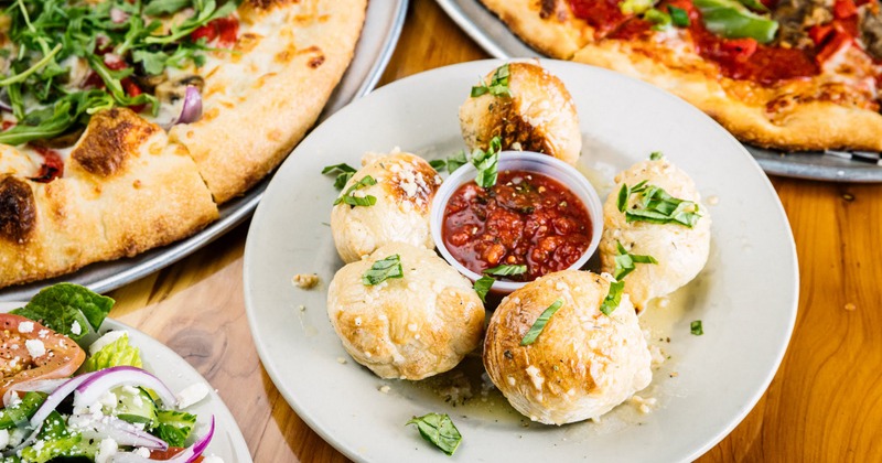 Round cheese bread loafs with meat dipping sauce