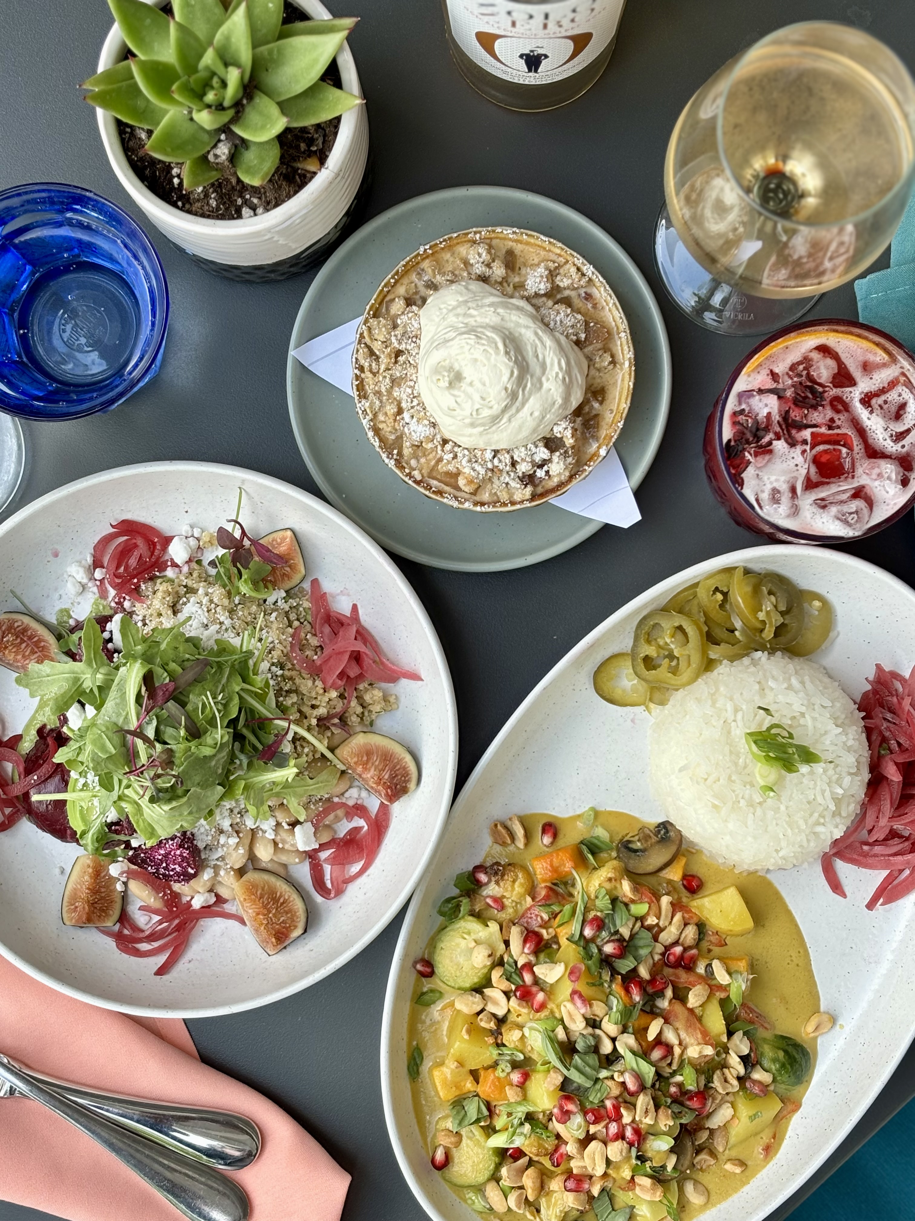 Photo of our beet avocado bowl, curry and mocktails