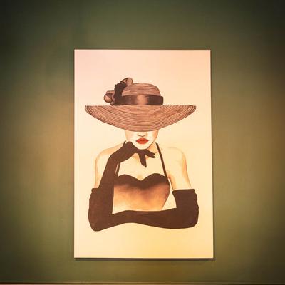 Portrait of a stylish person wearing a hat.