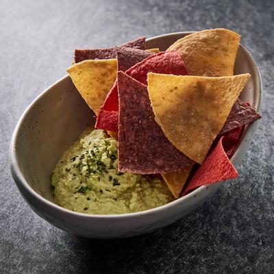 Edamame dip with tortilla chips.