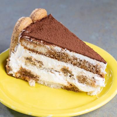 Slice of tiramisu served on a plate.