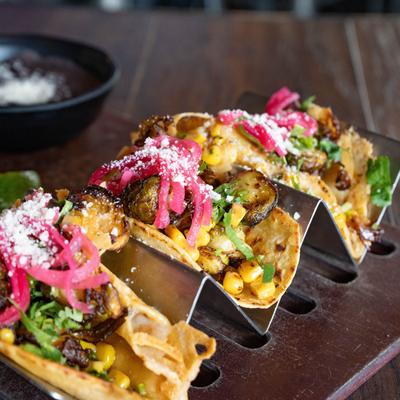 Tacos with veggies and corn salsa.