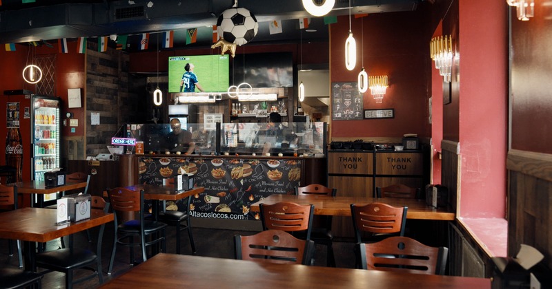 Interior, tables and chairs in dining area