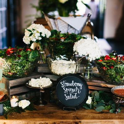 A strawberry spinach salad and other arrangements.