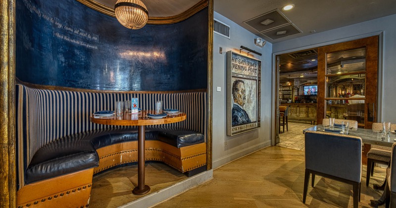 Interior seating place with a circular half booth and a table