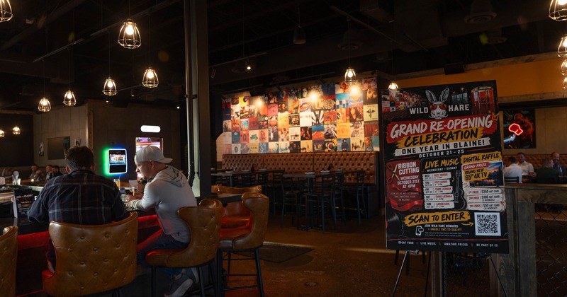 Interior, bar, people, booths behind