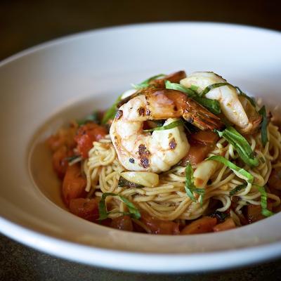 Angel hair pasta with shrimp, served with a dip