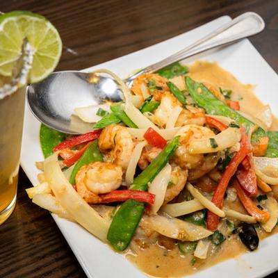Spicy Coconut Shrimp served alongside Margarita cocktail.