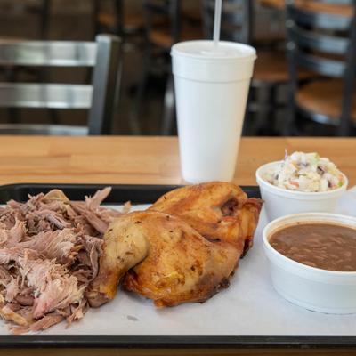 Two meat combo with puller pork, chicken, pinto beans, and coleslaw.