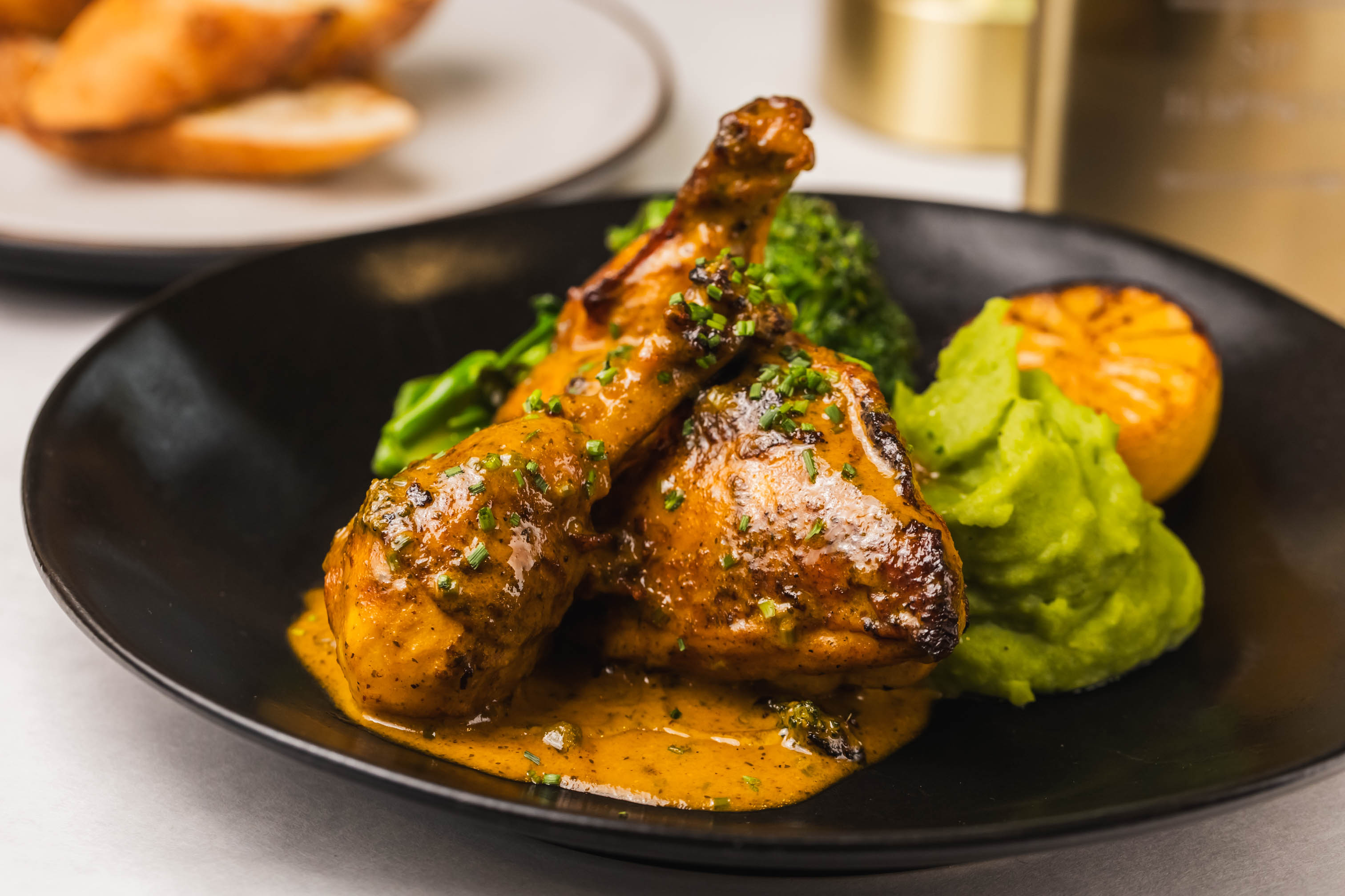Roasted chicken in orange lemon caper sauce