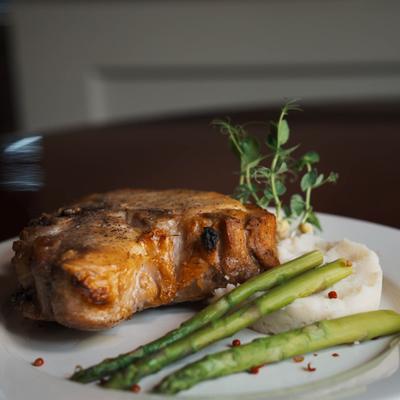Grilled veal chop, asparagus, and mashed potatoes.
