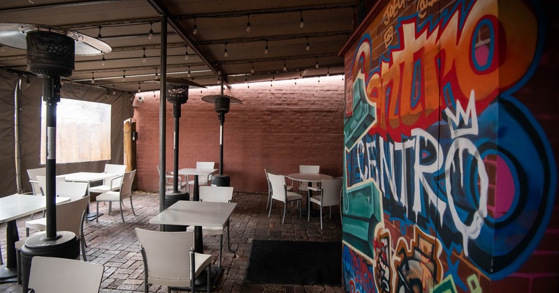 Interior, tables and chairs with decoration on the wall
